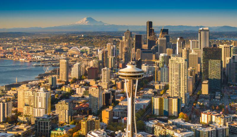 An image of the Seattle skyline that includes the Space Needle and Mount Rainier in the distance